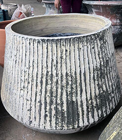 Thai limestone pots -- Fluted Torquelstone with vertical ribbing at Thomson's Garden Centre Orange NSW